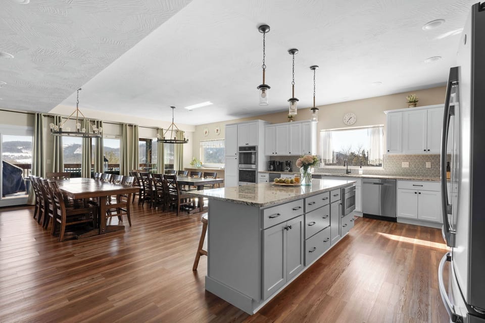 - Cook, dine, and gather in this wide open space that brings everyone together in one bright, happy area
- Kitchen flows right into the dining room, making meals feel fun & easy
- Whether it's breakfast with two or dinner for ten, this space is ready