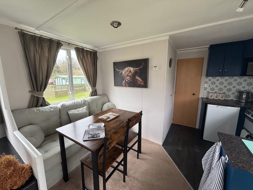Dining table with bench seating and 2 extra chairs. 