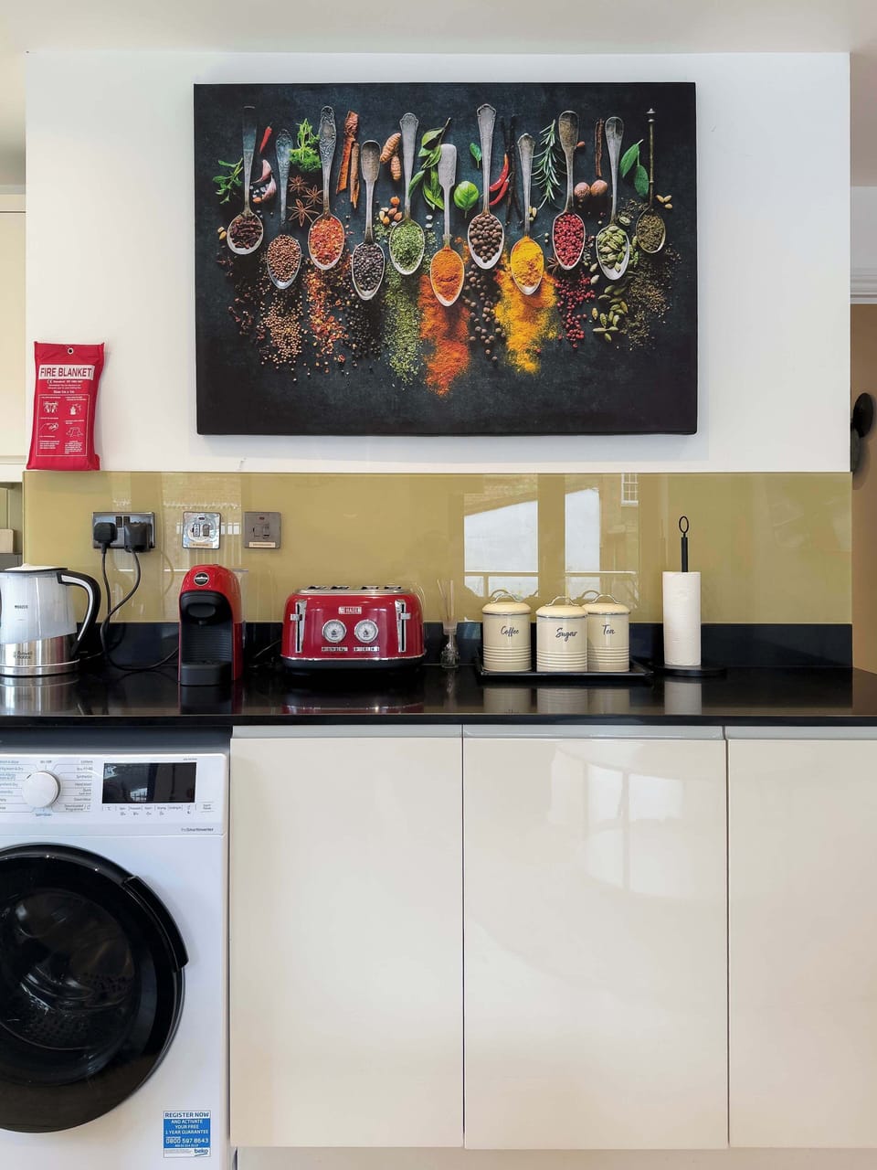 A sleek, modern kitchen thoughtfully equipped with premium appliances and everything you need to cook, dine and feel right at home