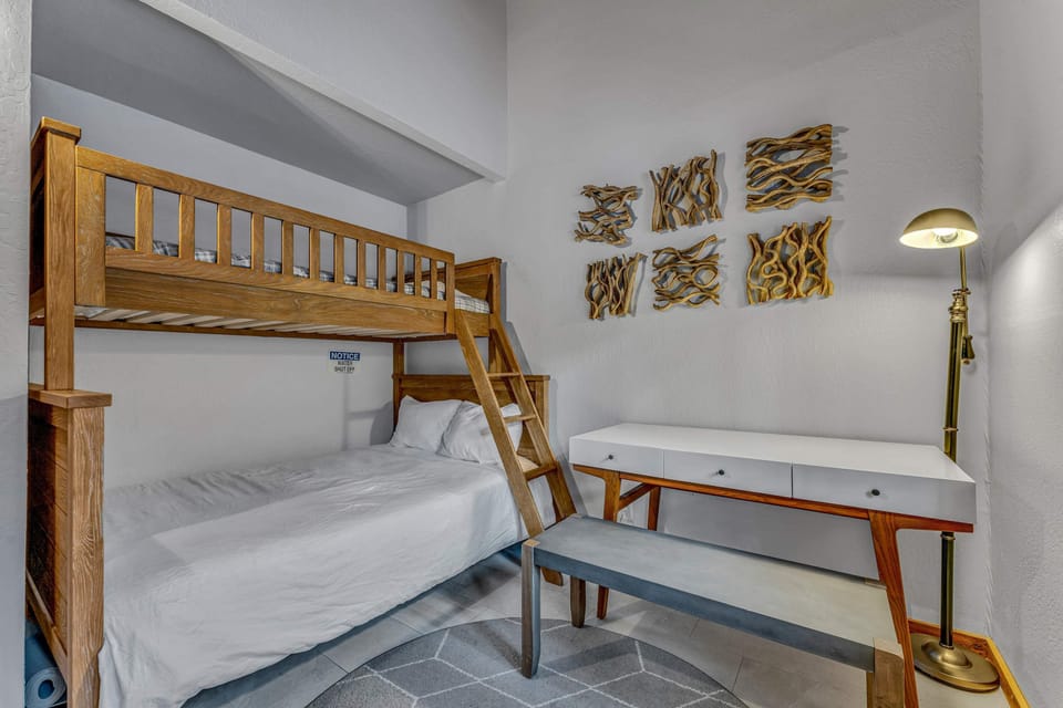 Bedroom 4: Twin-over-full bunk bed, lower floor, Smart TV, desk