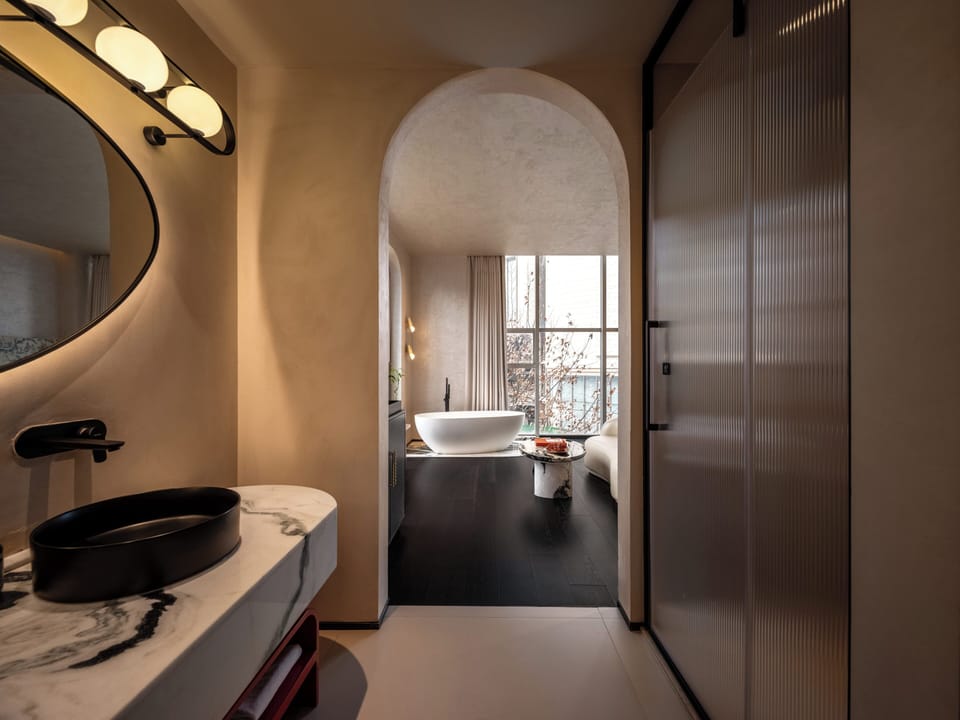 Exclusive Suite | Bathroom | Designer toiletries, hair dryer, bathrobes, slippers