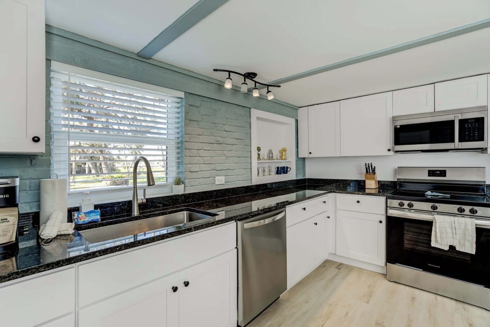 A stylish and fully equipped kitchen with modern appliances, granite countertops, and ample storage—perfect for preparing delicious meals.