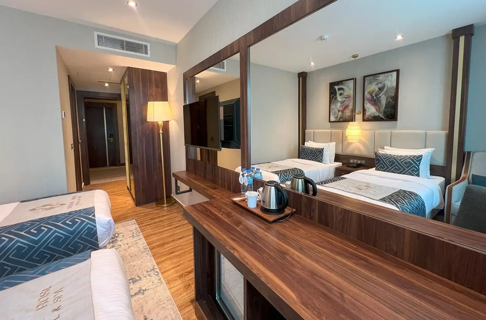 Standard Double or Twin Room | In-room safe, desk, laptop workspace, blackout drapes