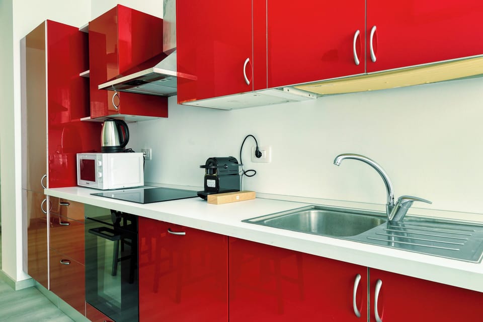 Apartment, 2 Bedrooms, Balcony | Private kitchen | Dishwasher, espresso maker, electric kettle, dining tables