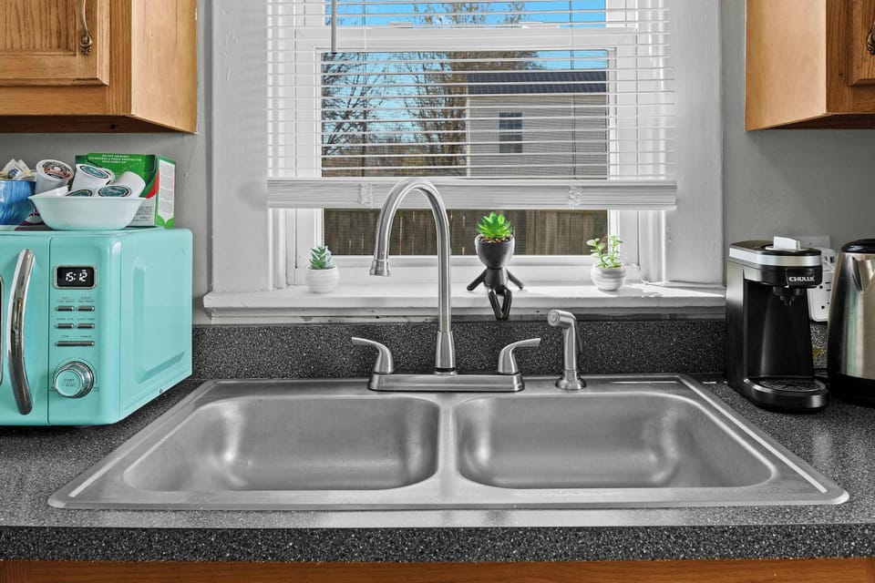 Kitchen: This home features a spacious kitchen- perfect for creating home-cooked meals!