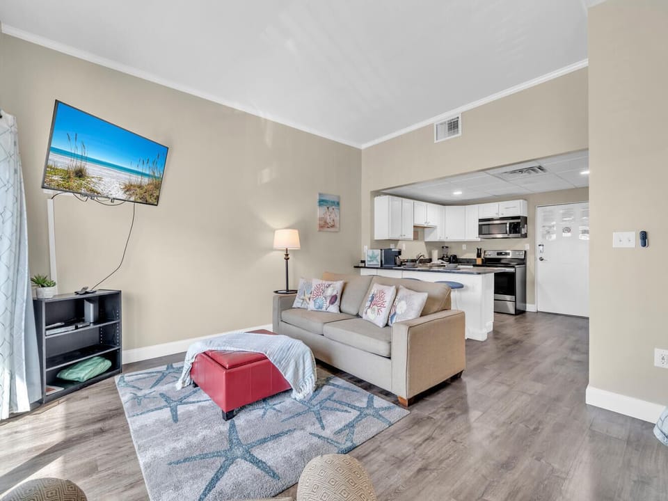 Your bright, open living space includes a sleeper sofa and flows seamlessly into the fully equipped kitchen, perfect for relaxing after beach adventures.