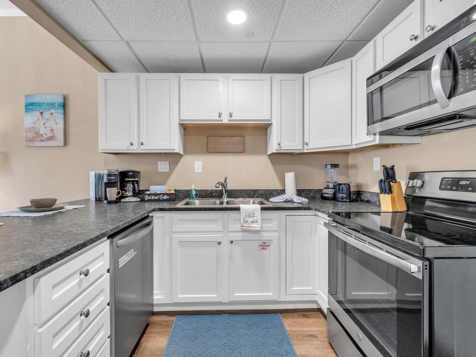 Your spacious kitchen features modern appliances and granite countertops, perfect for preparing meals during your stay.
