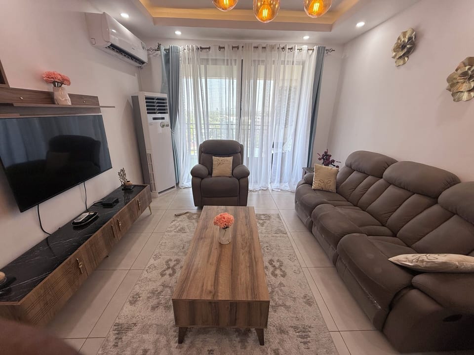Luxury Apartment, Balcony, Partial Ocean View | Living room | Flat-screen TV