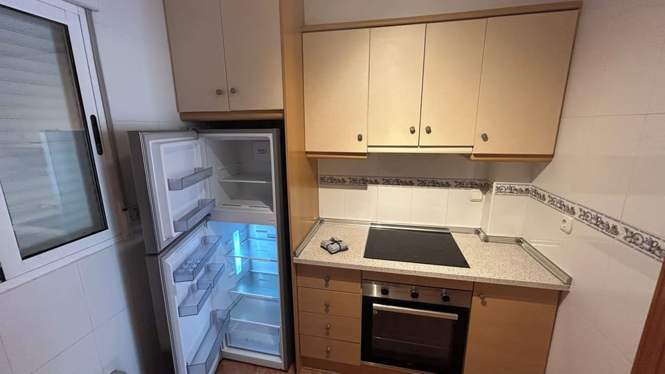 Bahia Kitchen view fridge & cook
