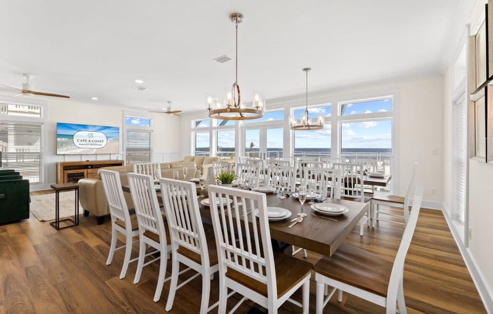 Gather around this elegant dining table where memorable meals unfold, with stunning ocean views creating the perfect backdrop for your coastal getaway conversations.
