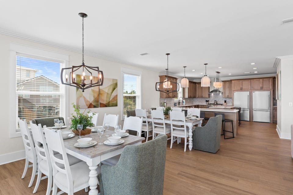 Your open-concept dining and kitchen area invites shared meals and easy conversation. Enjoy natural light, modern appliances, and stylish touches throughout this welcoming space.
