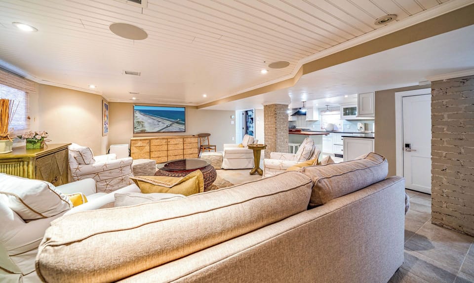 Living room area with lots of plush seating
