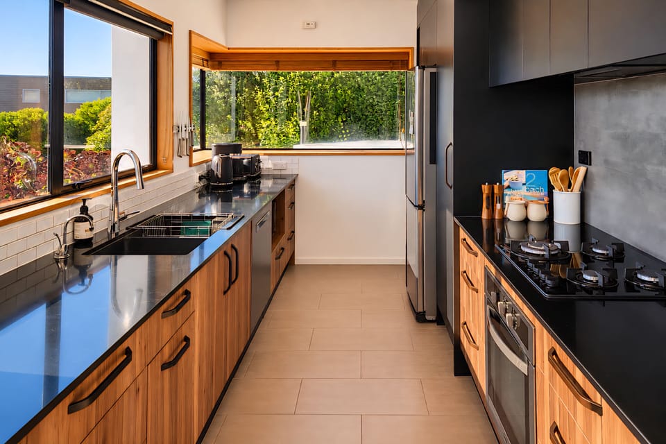 Fully equipped kitchen with quality appliances and ample space to cook