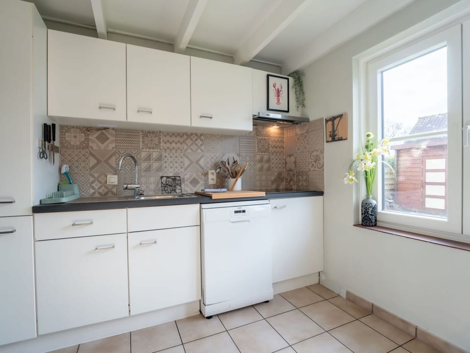 Kitchen, Countertop, Kitchen Appliance, Major Appliance, Cabinetry, Interior Design, Flooring, Plumbing Fixture, Sink, Home Appliance