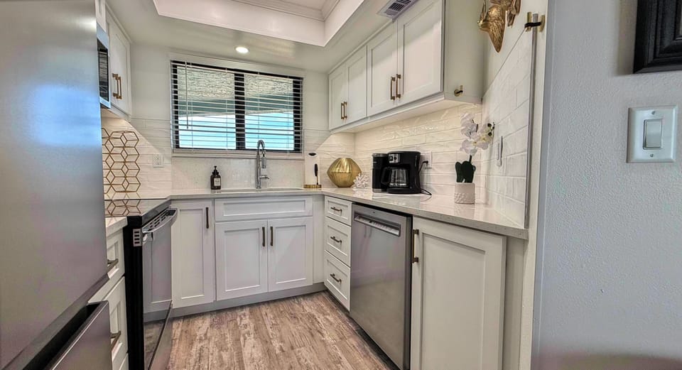 Ocean Trillium 303 (OT303) - New Smyrna Beach - Freshly renovated fully equipped kitchen boasts granite counters - Starter Supplies
