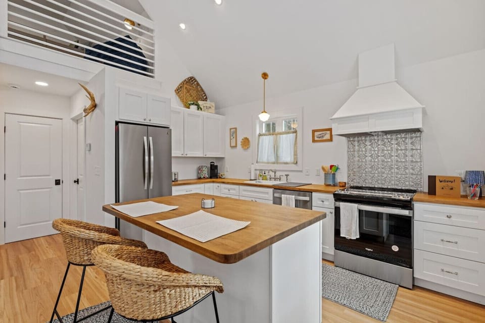 Modern kitchen stocked for weekend stays or longer visits.