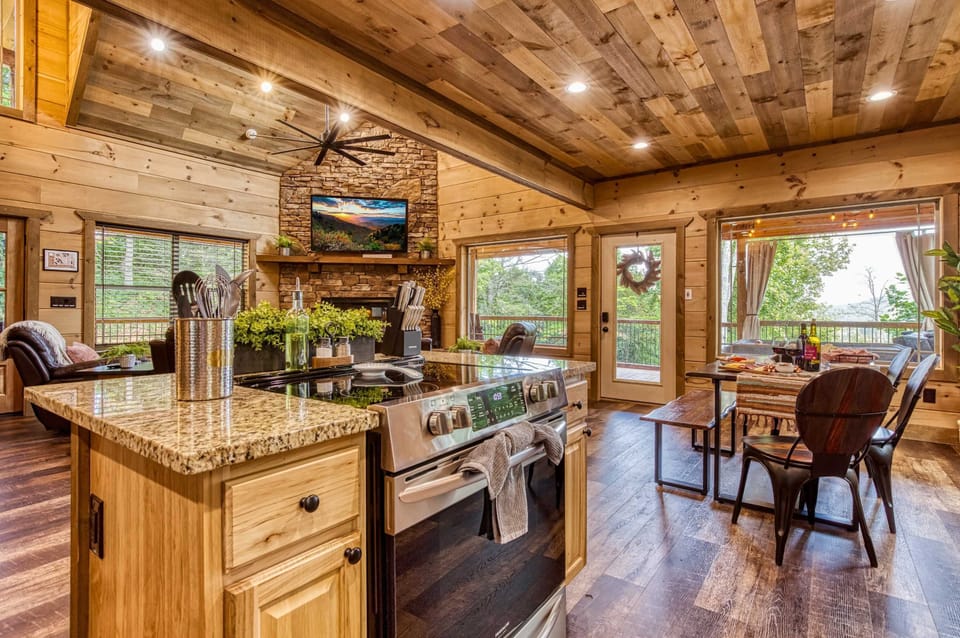 Enjoy the open-concept layout connecting kitchen, dining, and living spaces—perfect for entertaining or relaxing in your secluded Gatlinburg getaway.