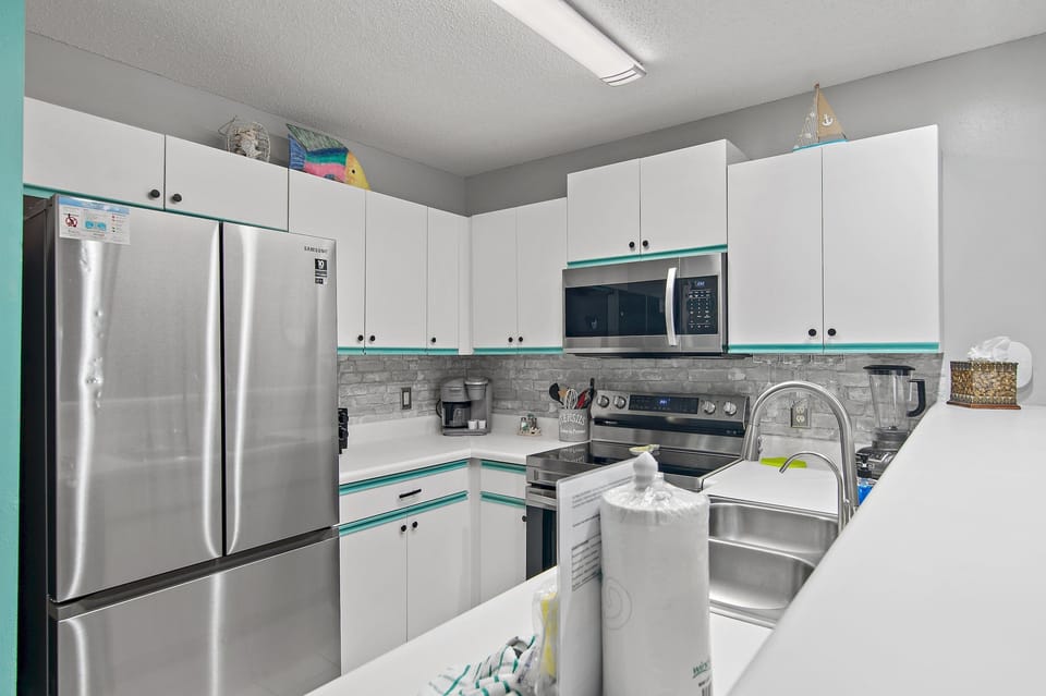 Stainless appliances and everything you need to cook in.