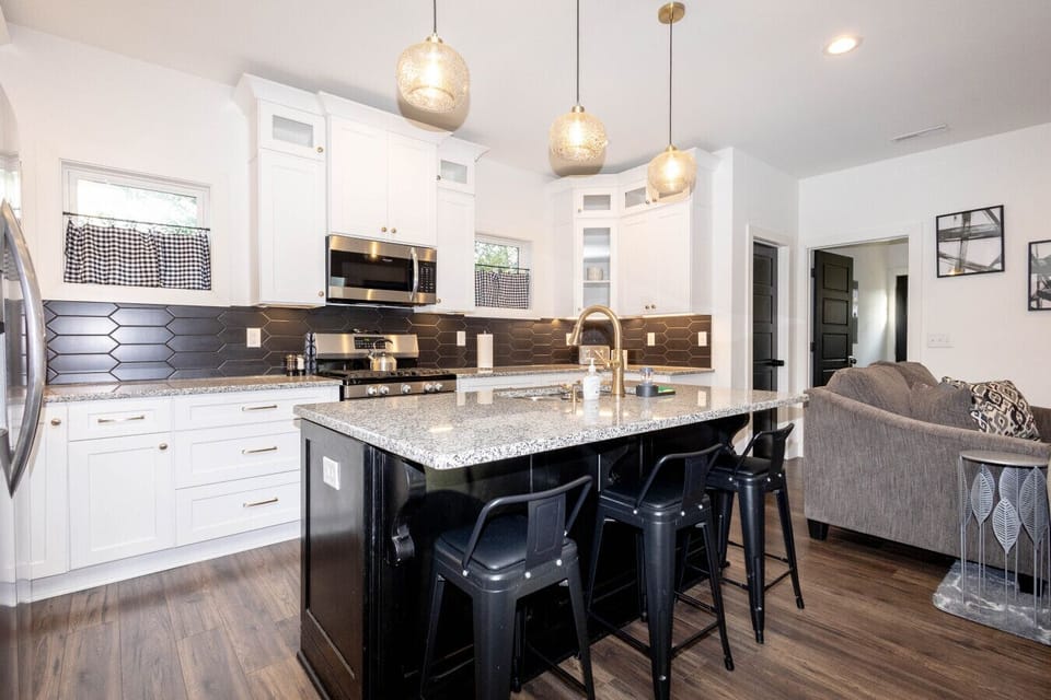 Fully equipped for your culinary needs, the kitchen offers stainless steel appliances, a gas range, plenty of counter space, and a coffee station to start your day right.
