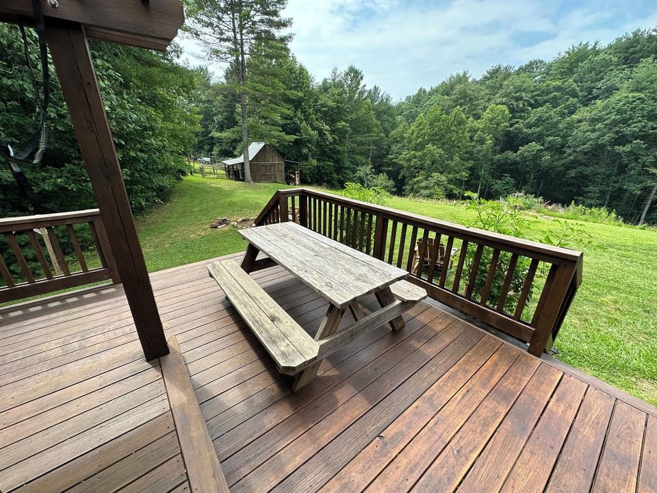 Picnic table on back deck for outdoor dining