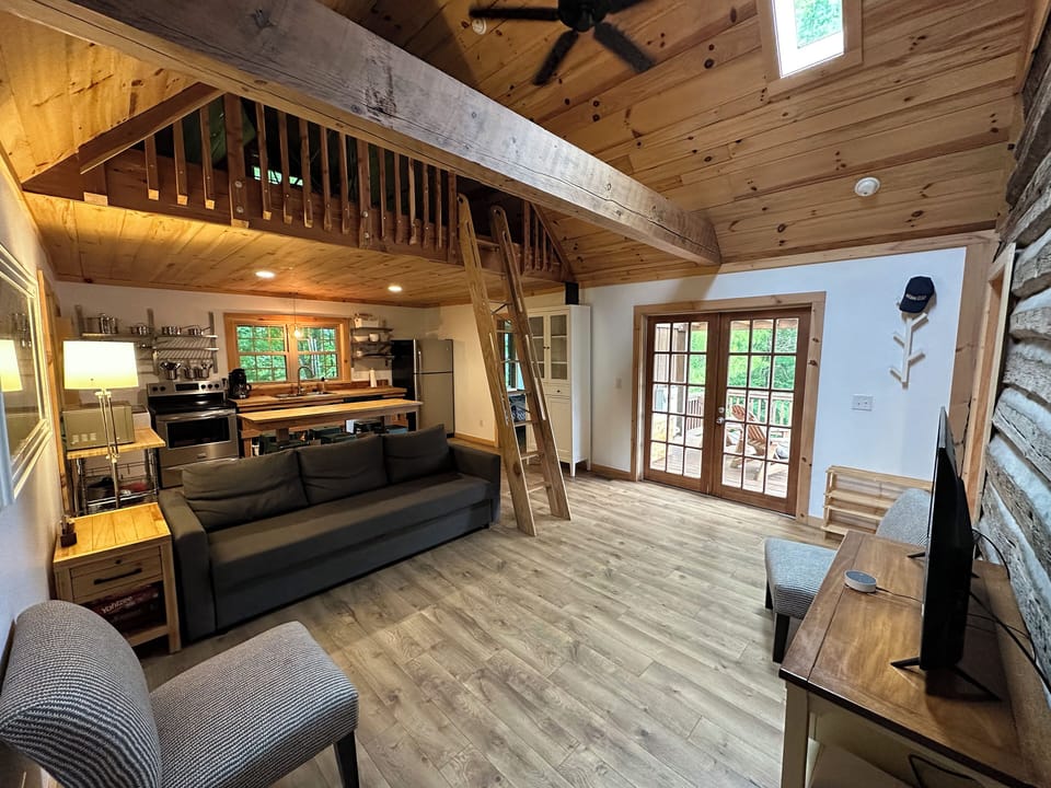 Main room includes smarttv, bar height dining for 8, full kitchen, and main loft