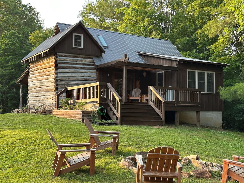 Back deck provides privacy, outdoor dining, fire pit, and beautiful farm views