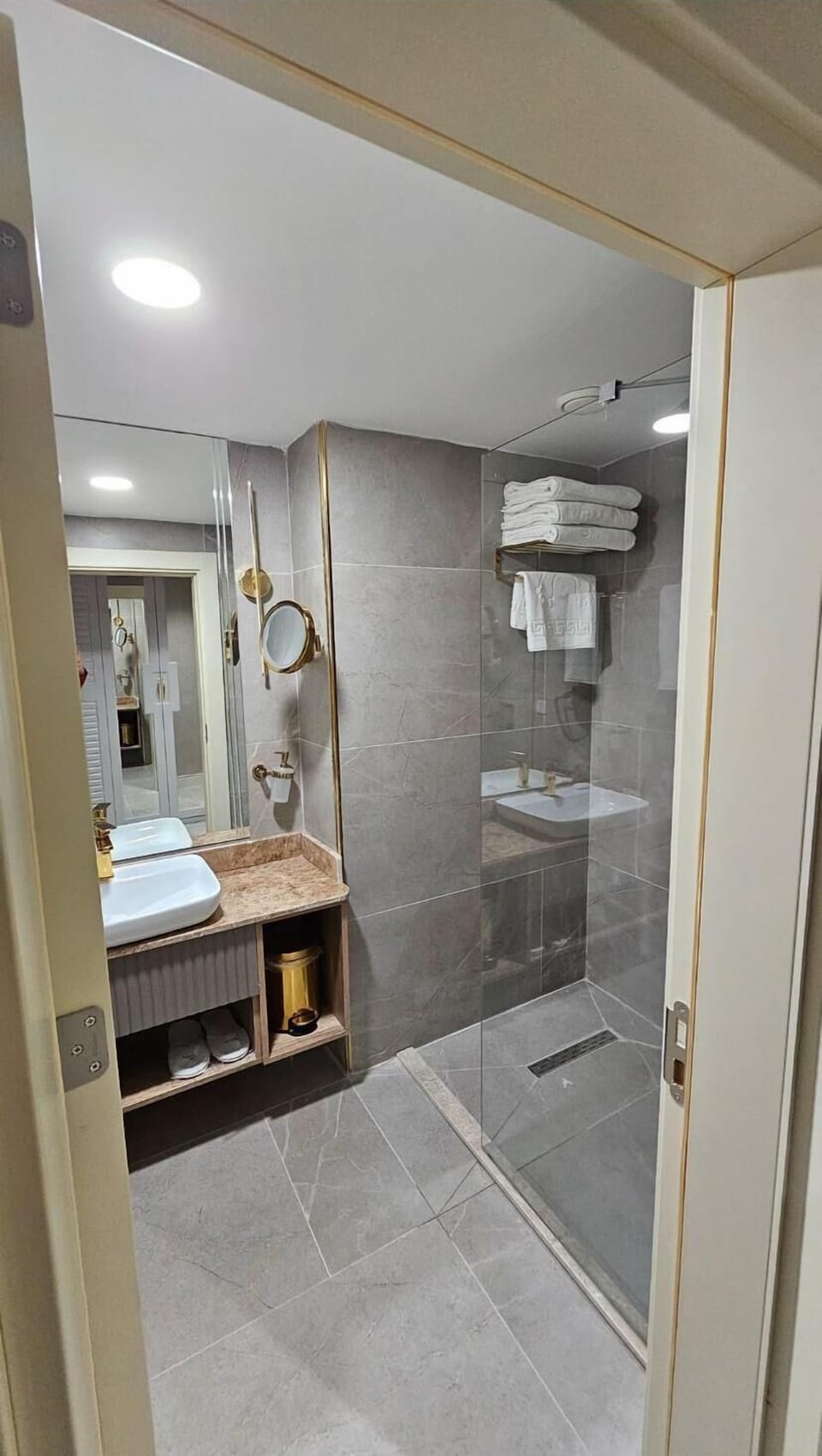 Shower, hair dryer, slippers, towels