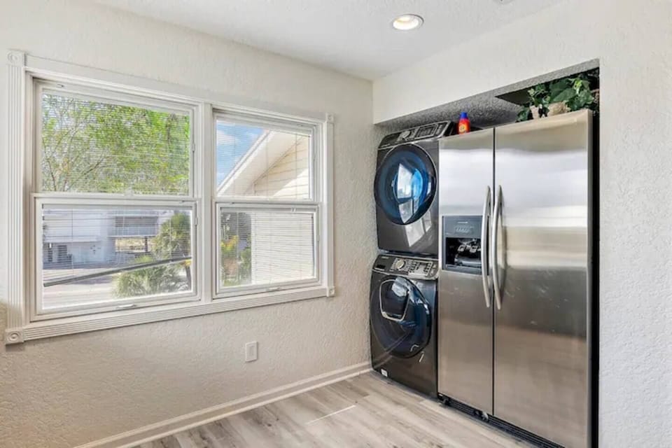 Laundry room w/ extra large washer & dryer conveniently located in kitchen