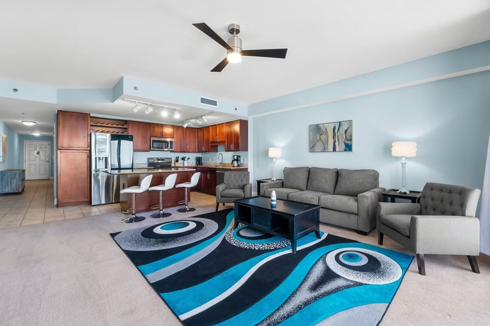 Open-concept living area with modern kitchen and stylish seating.