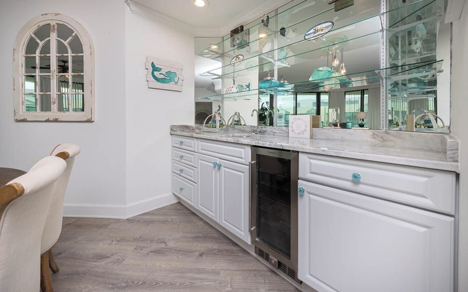 Grab a chilled bottle from the wine cooler or create your favorite cocktail at the wet bar
