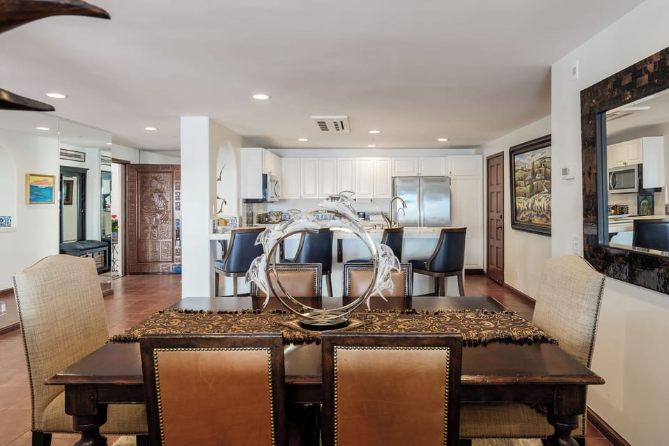 Gather for memorable meals in this sophisticated dining space, where elegant furnishings and thoughtful design create the perfect setting for your conversations.