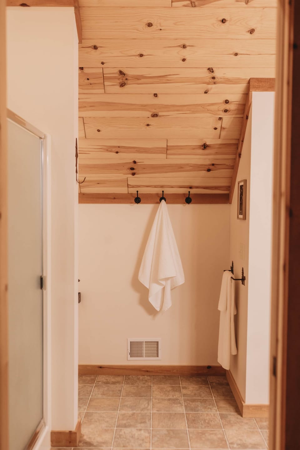Upstairs bathroom with shower stall