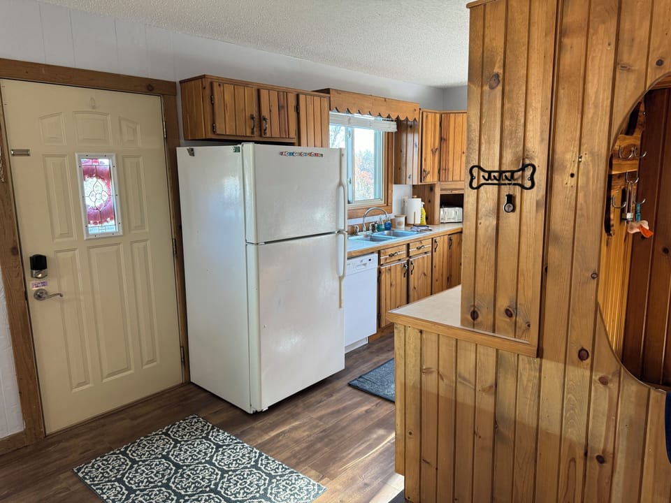 View from dining room to galley kitchen. Fully stocked and with spices! 