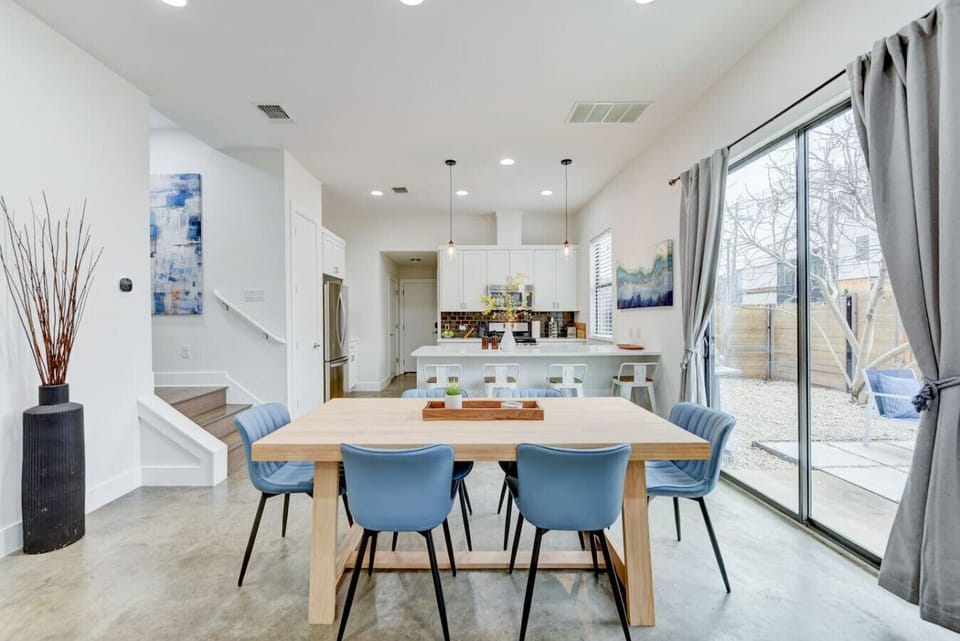 Host a memorable meal at this stylish dining table, seamlessly connected to the open-concept kitchen and living space.