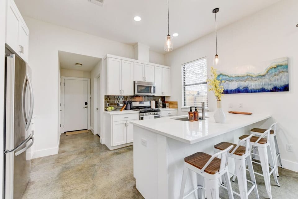 Gather around the spacious kitchen island, perfect for morning coffee, casual meals, or just hanging out while dinner is being prepared!