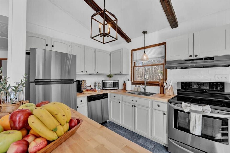 Spacious stainless steel refrigerator—plenty of room to store all your favorite meals and drinks during your stay!