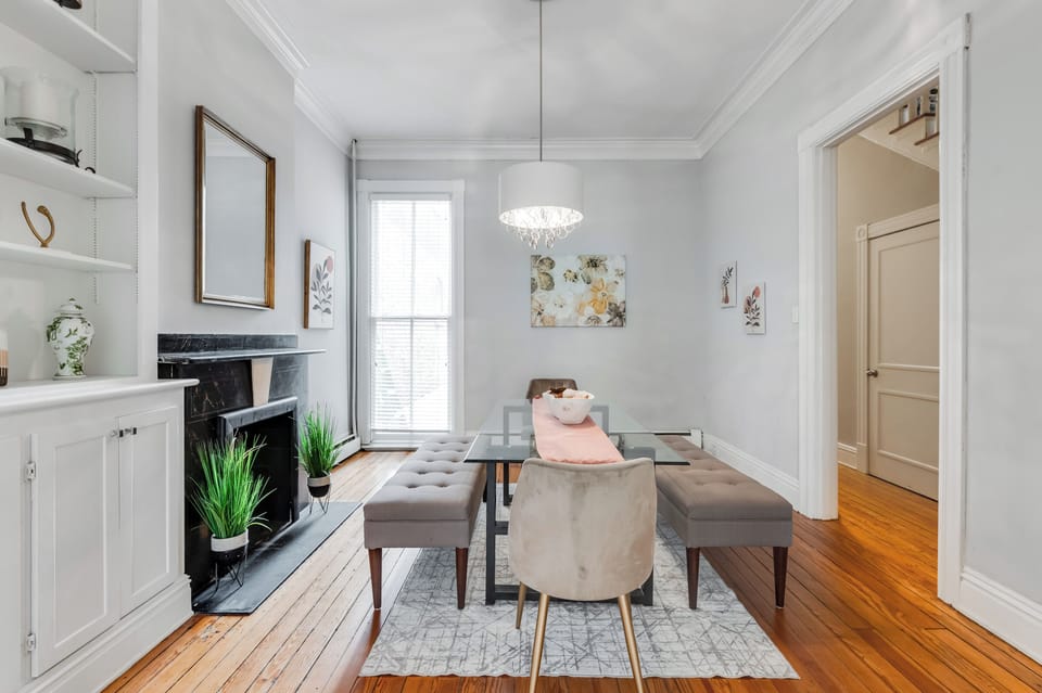 Dining Room: Elegant space with a glass table, chic seating, and vibrant artwork for memorable meals!