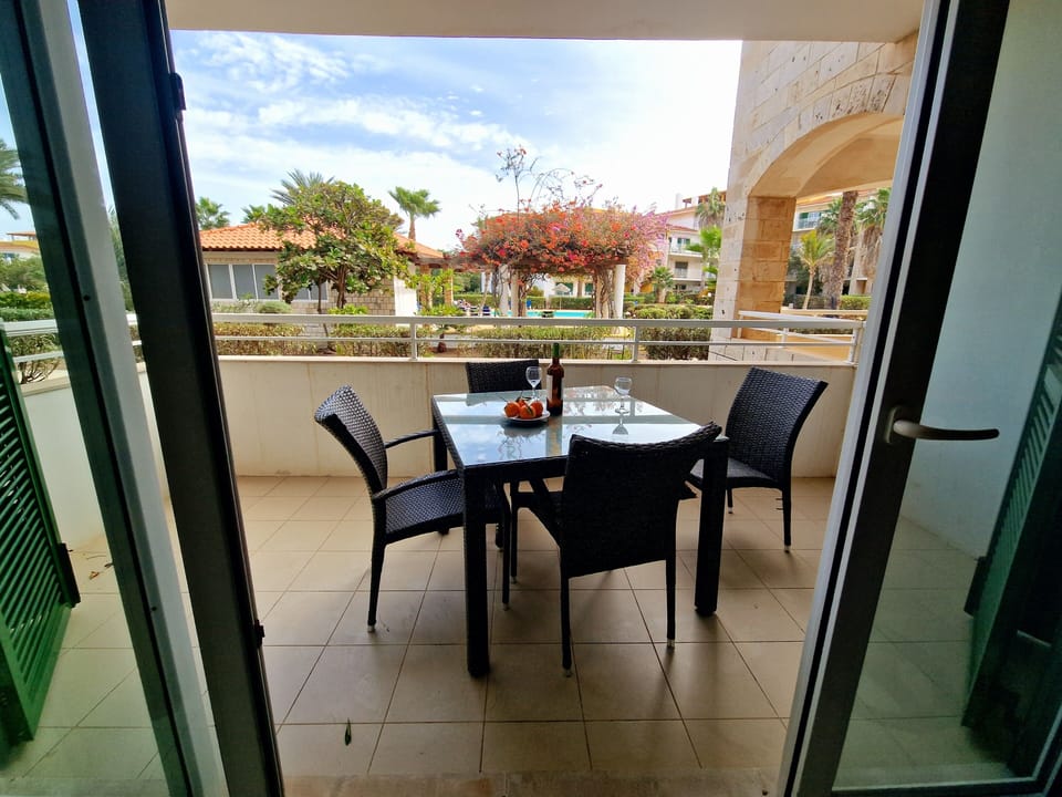Private balcony with outdoor dining furniture