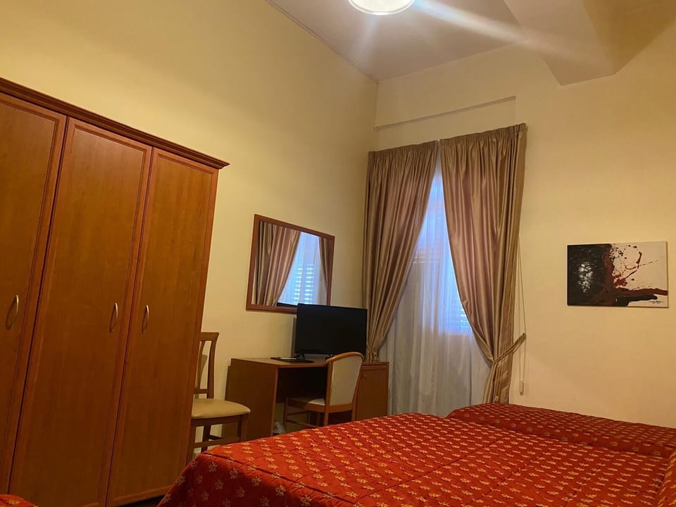 Standard Quadruple Room, Balcony | In-room safe, desk, free WiFi, bed sheets