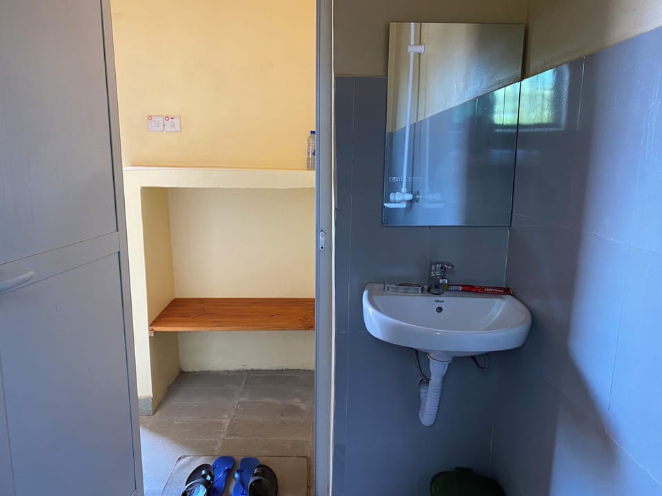 Shower, slippers, soap, toilet paper