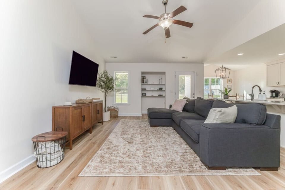 Relax and recharge in this spacious, sunlit living room.