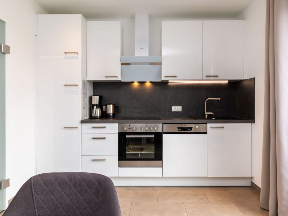 Kitchen Appliance, Kitchen, Countertop, Cabinetry, Interior Design, Major Appliance, Wood, Furniture, Flooring, Home Appliance