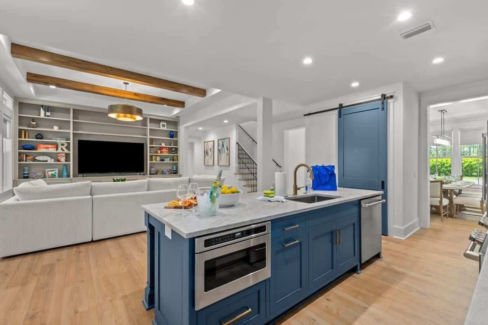 Open kitchen with oversized island to living area.