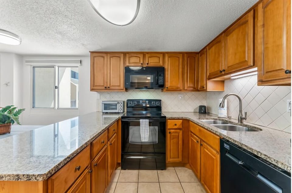 You have plenty of beautiful granite counter space for prep and serving.
