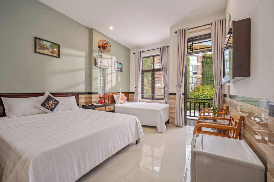 Deluxe Triple Room, Balcony, Garden View | Minibar, desk, blackout drapes, soundproofing