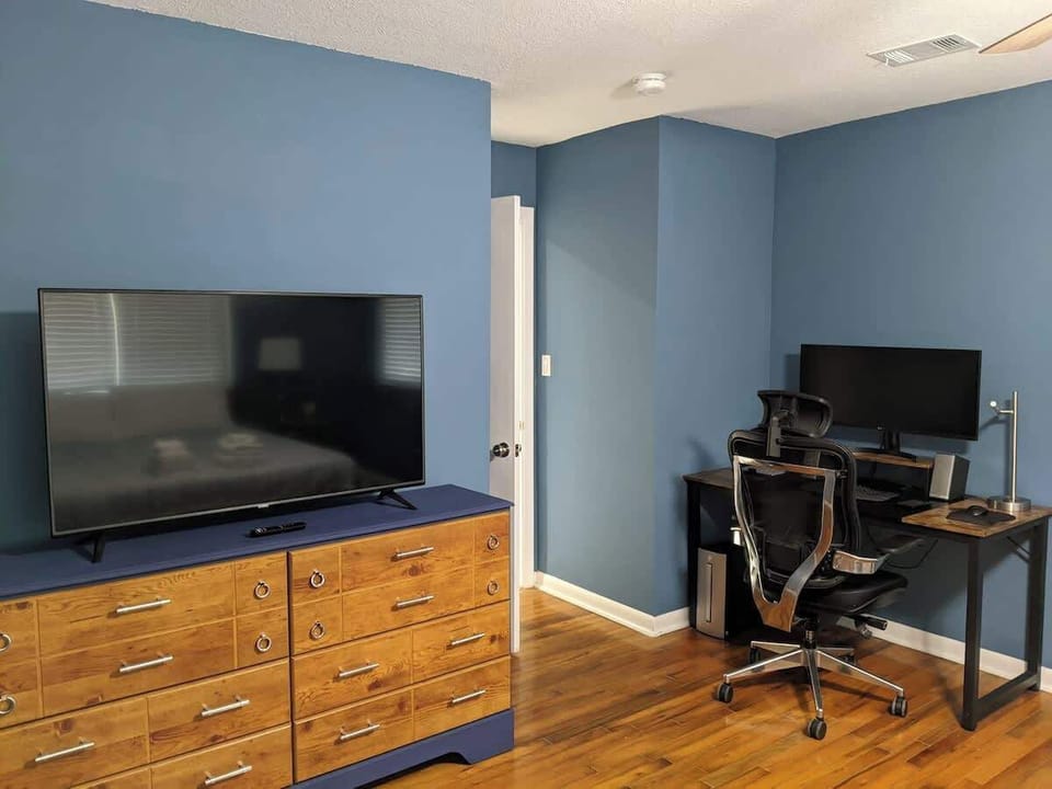 This Master bedroom includes a dedicated work nook, ideal for catching up on emails or working remotely.