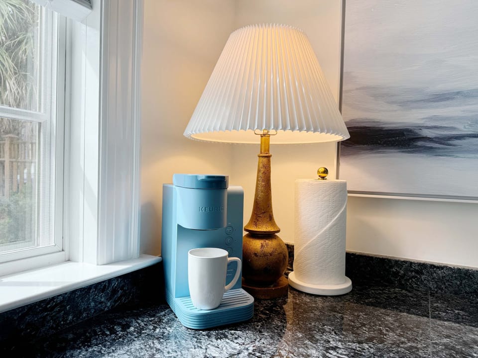 Keurig coffee maker is located in the kitchen. 