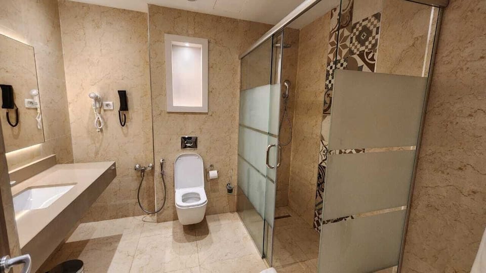 Shower, free toiletries, hair dryer, towels
