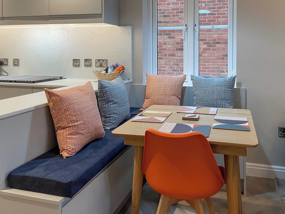 Dining seating -4-6 seater table with under bench storage | Esk View Apartment, Whitby