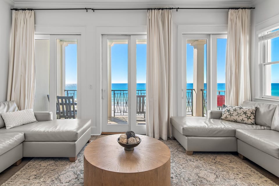 Living Room with TWO large, easy-to-clean leather sectionals, Gulf views, and a 65” Smart TV - watch the big game with a view!